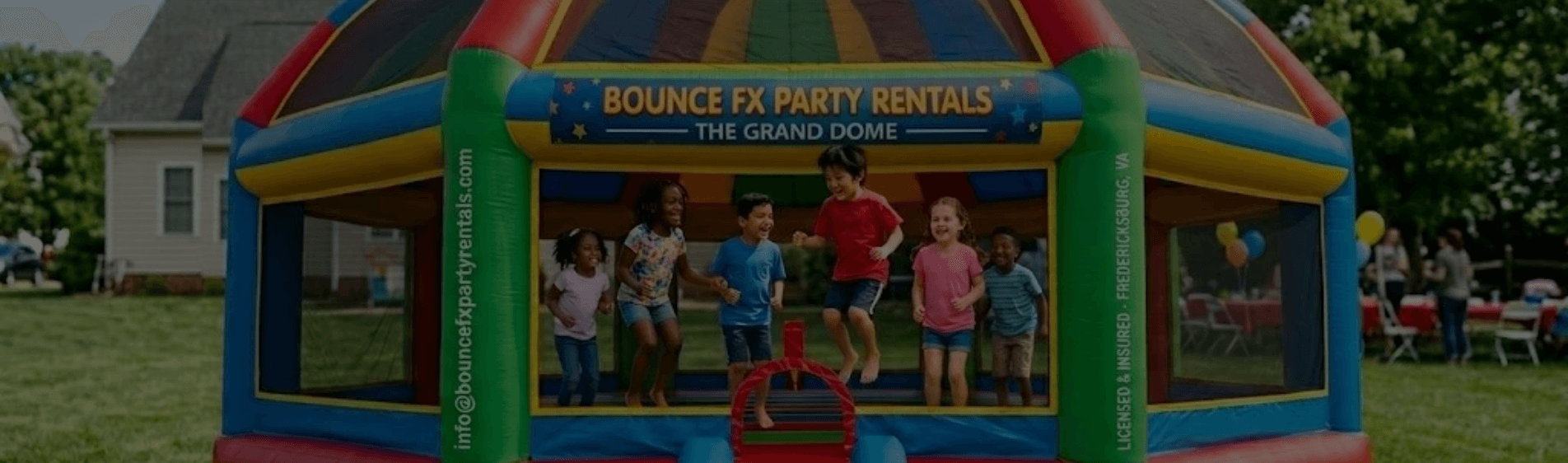 Kids jumping inside the Bounce FX Grand Dome bounce house at a backyard party in Fredericksburg, VA